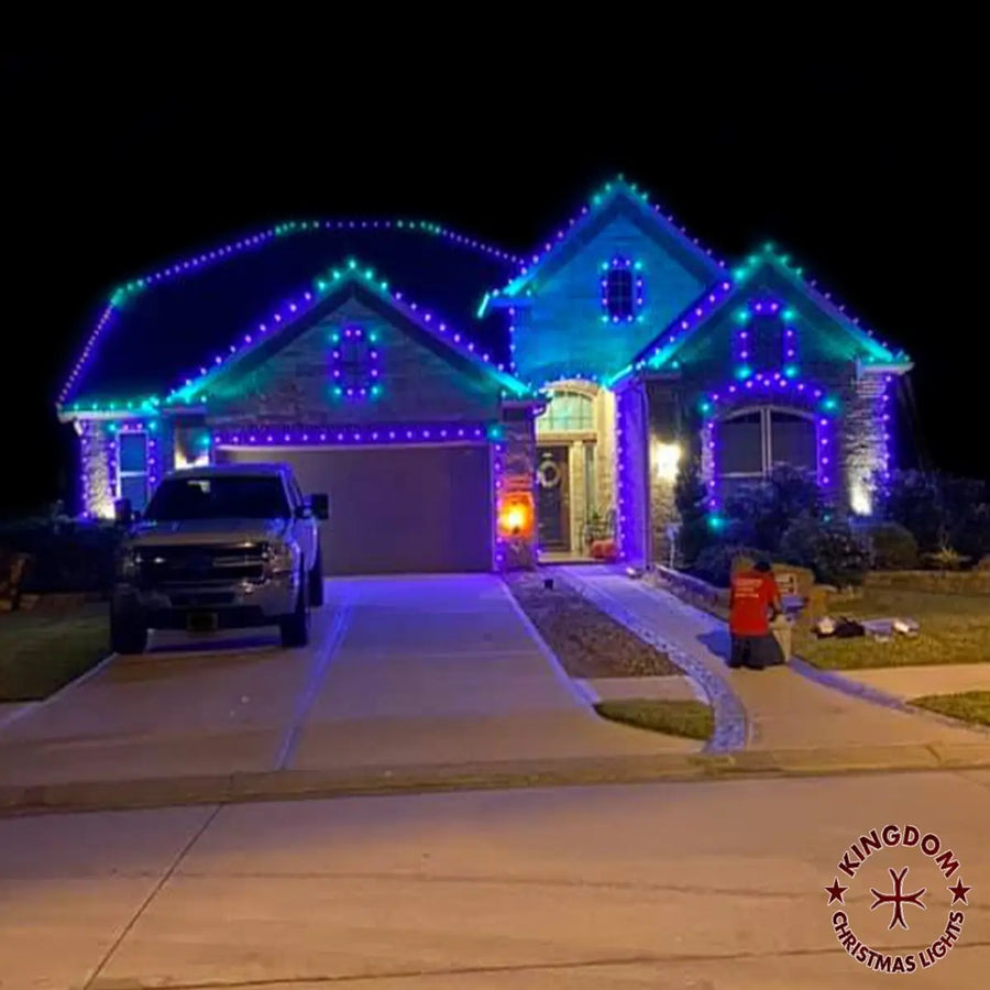 Richmond home with purple and teal lights outlining the roofline, peaks, and front windows.