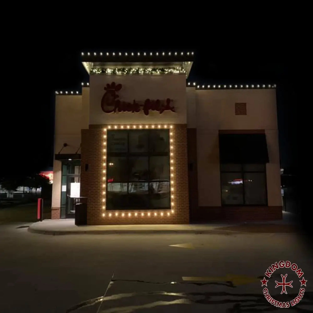 Chick-fil-A restaurant entrance framed with warm white Christmas lights