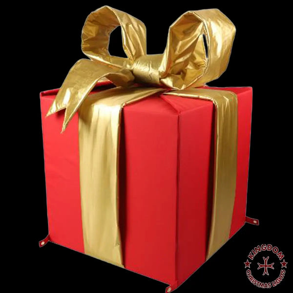 Red gift box with a gold ribbon on a black background