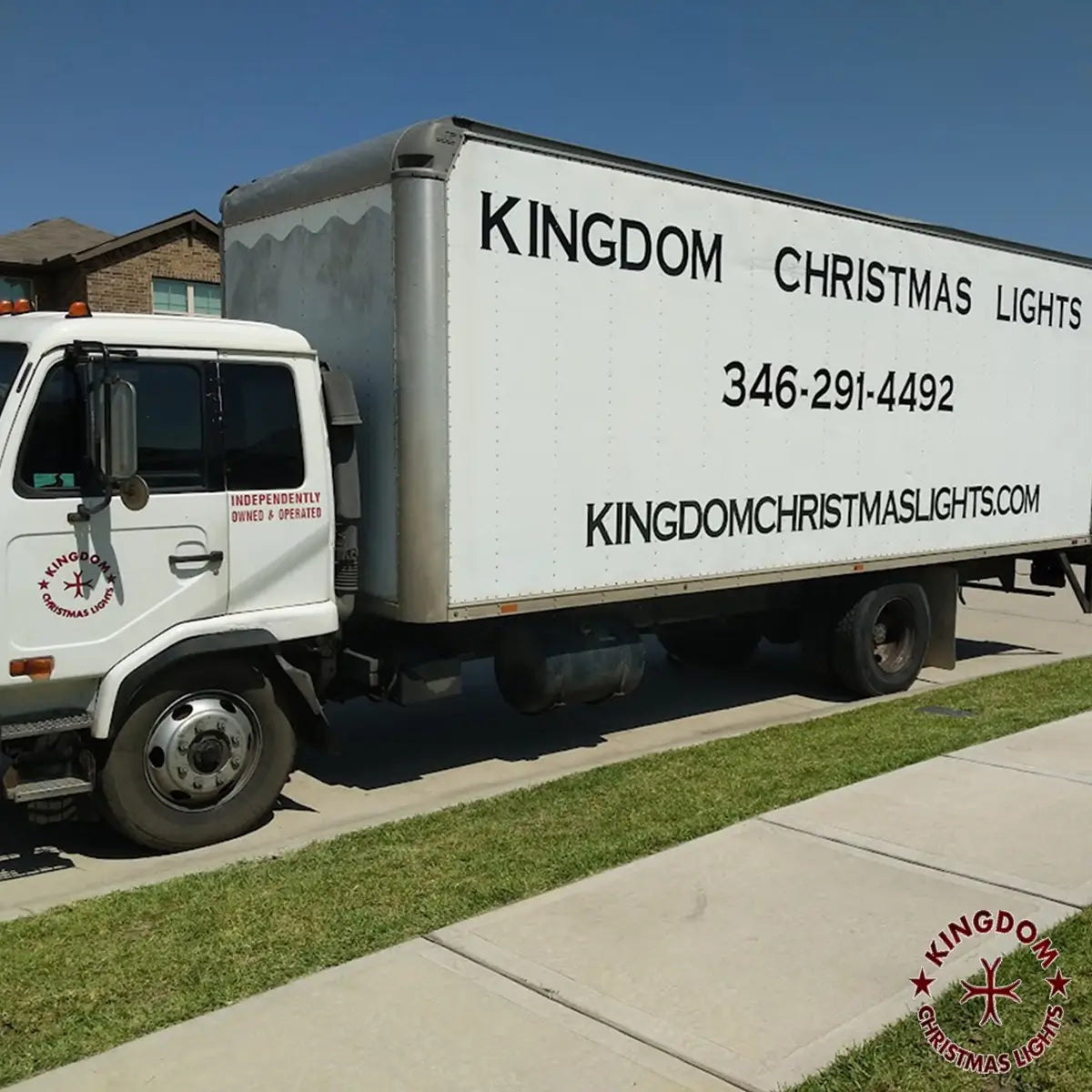 Kingdom Christmas Lights service truck parked outside