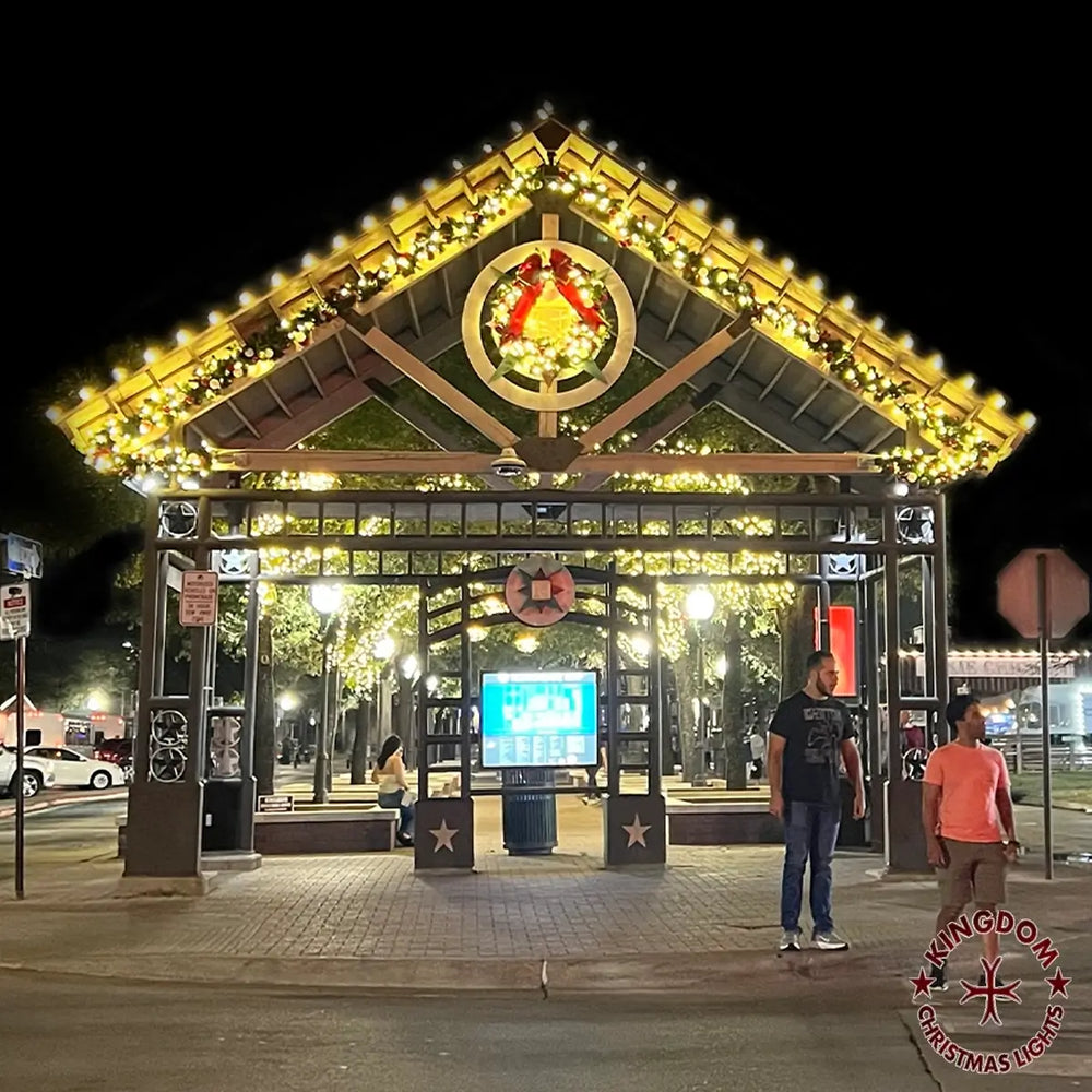 Public entrance pavilion decorated with illuminated garland and a Christmas wreath