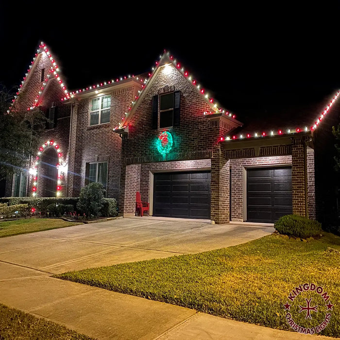 Brick house decorated with Christmas lights at night