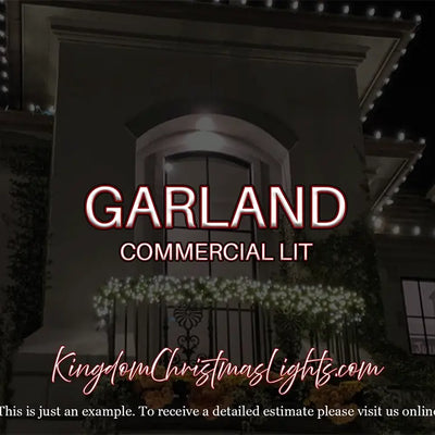 Decorative Christmas lights on a building with 'Garland Commercial Lit' branding.