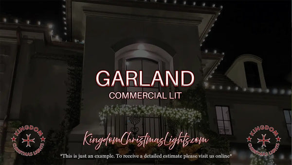 Decorative Christmas lights on a building with 'Garland Commercial Lit' branding.