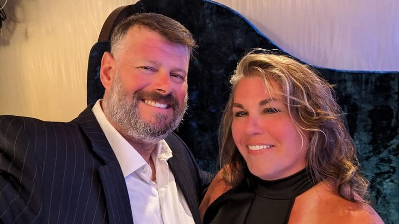 Ron Robey with Laura Robey at a dinner party